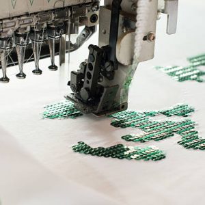 a special machine that sews sequins on textile
